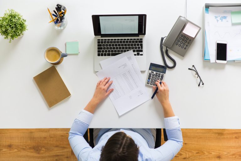 businesswoman with tax report at office